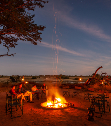 Guests enjoy sharing stories of the day around the fire at Verney's Camp.