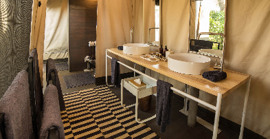 Machaba Web Botswana Gomoti Plains Camp Bathroom Family