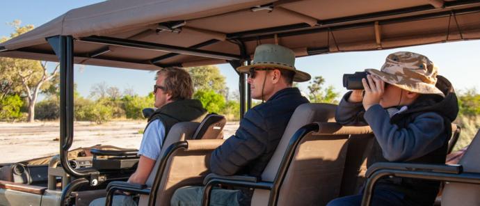 Machaba Safaris Okavango Delta Fly In Using Binoculars On Safari