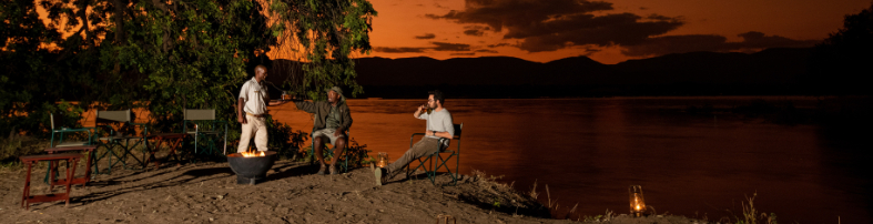 Machaba Zimbabwe Mana River Camp Sundowners By Zambezi River